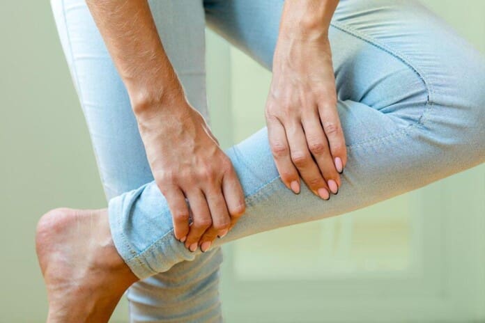 WomanWithRestlessLegSyndromeCalfPain.FI_-1024x683