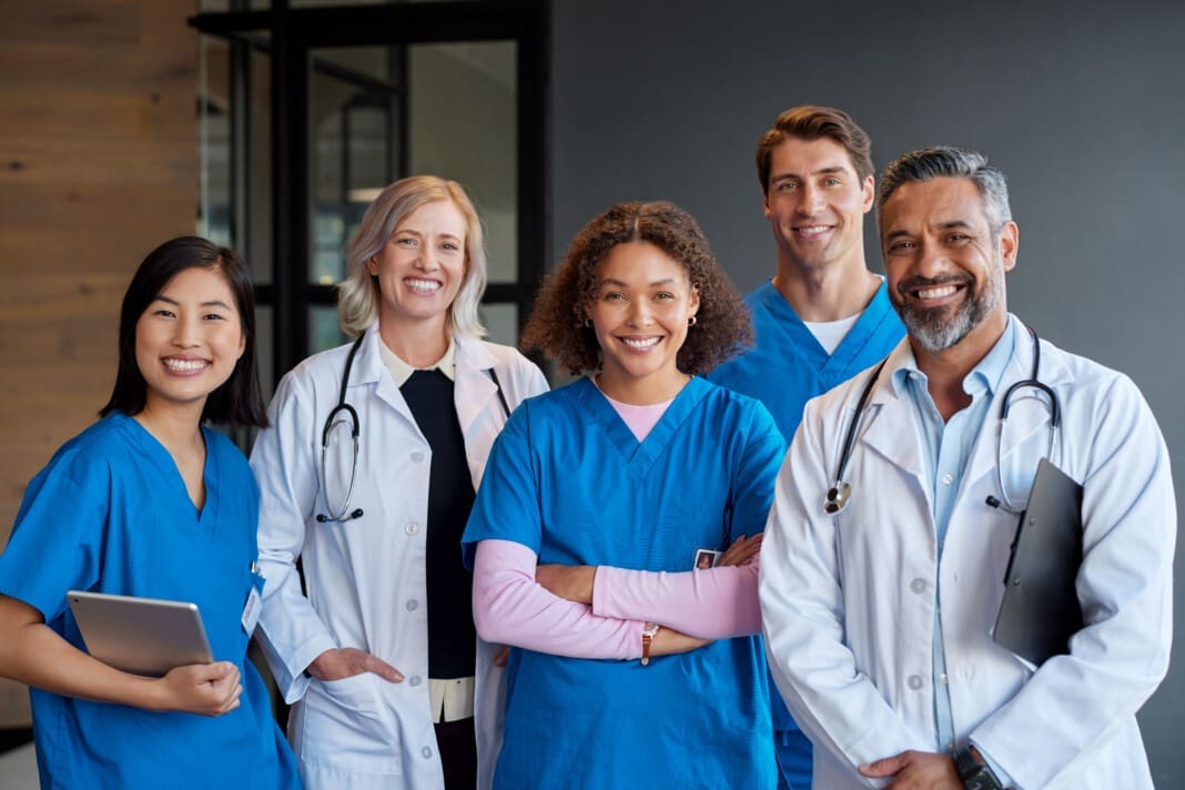 Portrait of happy smiling healthcare team looking at camera