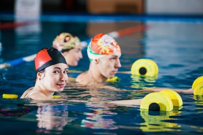 group-of-happy-people-on-aqua-fitness-in-swimming-2025-01-09-05-26-27-utc