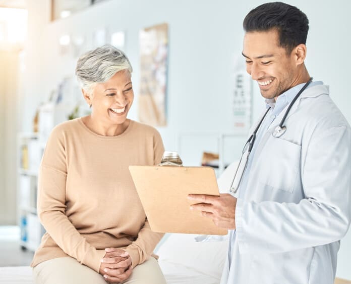 friendly-doctor-explaining-results-to-smiling-seni-2026-01-09-11-02-05-utc