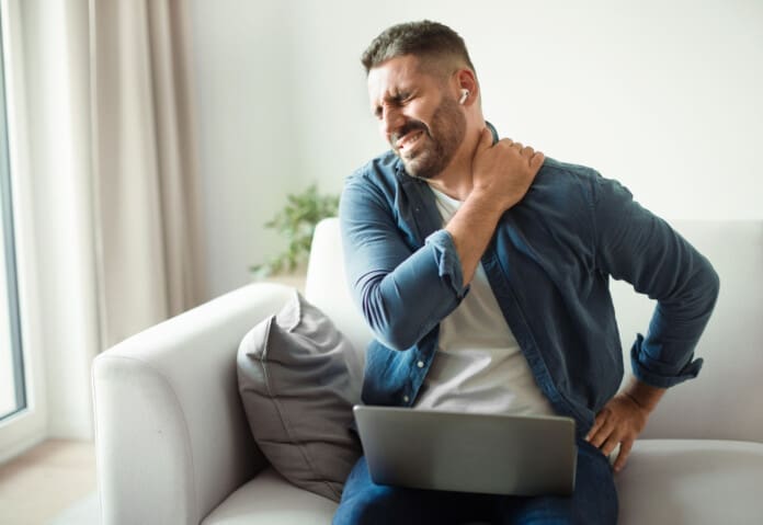 Middle Aged European Man Suffering From Neckache And Backache Indoor Delayed Symptoms After a Minor Auto Accident Awareness