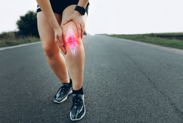 runner-with-knee-pain-on-desolate-road-2026-03-09-06-34-49-utc