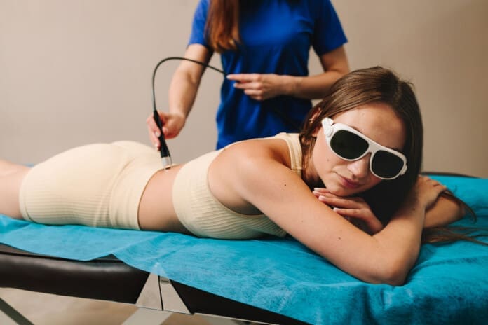 woman-receiving-laser-treatment-on-back-2026-04-04-23-51-38-utc_02 Innovative Light Therapies in Musculoskeletal Care Science